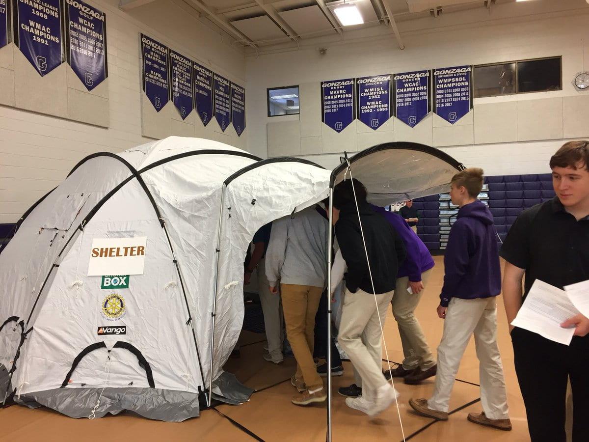 Gonzaga students enter a simulated refugee shelter during the 2018 Ignatian Heritage Day. (Photo from Gonzaga Flickr account)