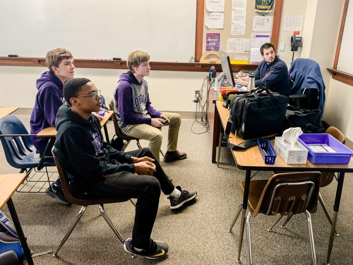 Moderator Stefan Vastek, math teacher, participates in gaming with students.