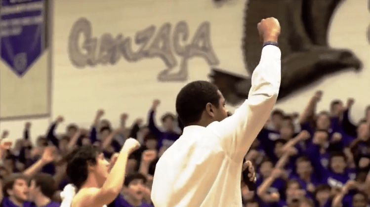 Mr. Devon Leary leads the alma mater at a pep rally. (Photo submitted by Mr. Devon Leary)