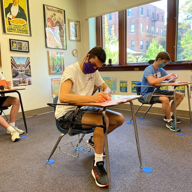 The hybird model requires students to wear masks and social distance, as seen in the photo. (Photo from https://www.gonzaga.org/return-to-eye-street-plan#) 