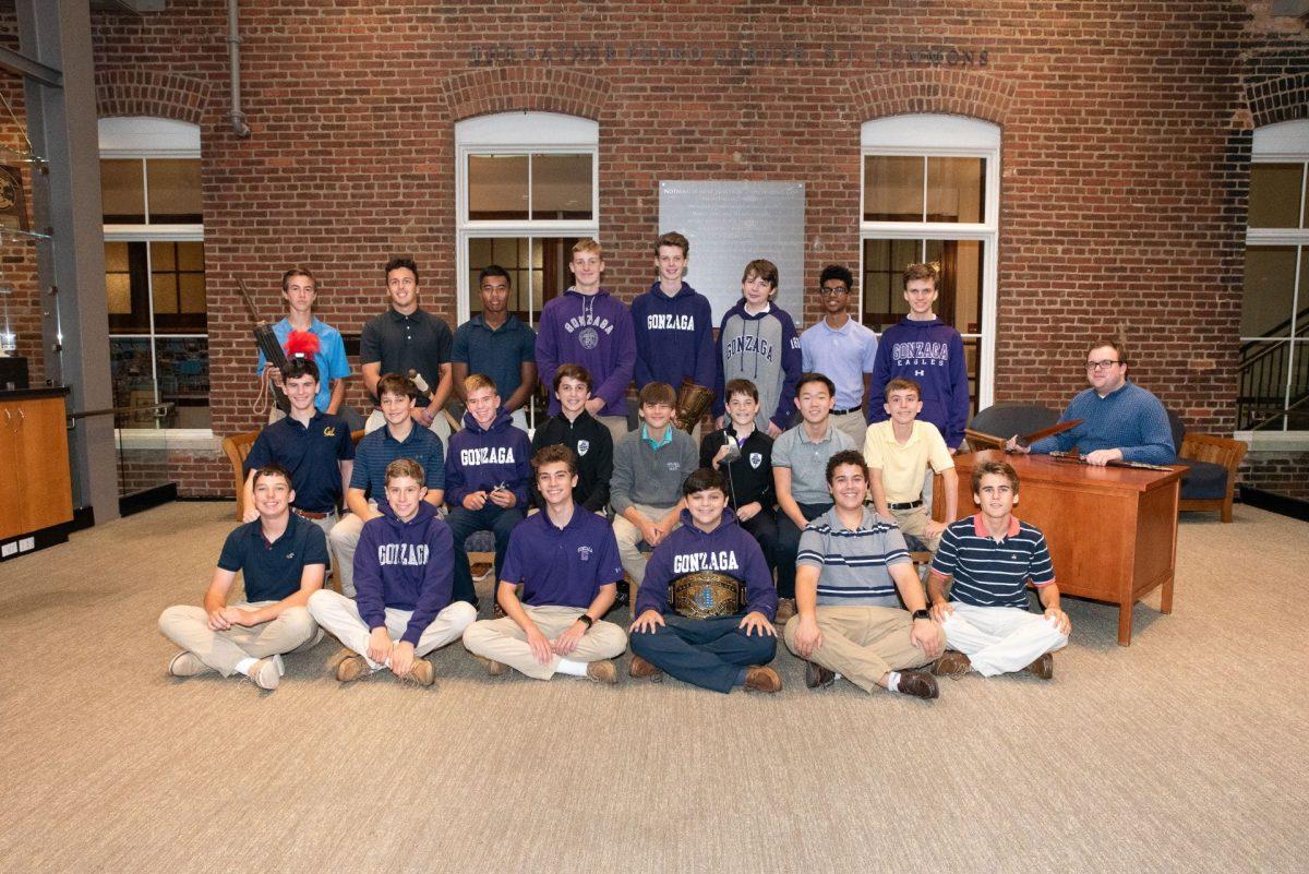 Mr. Carl Cardozo poses for photo with his students, taken last school year. (Photo by Ms. Laura Hudson)