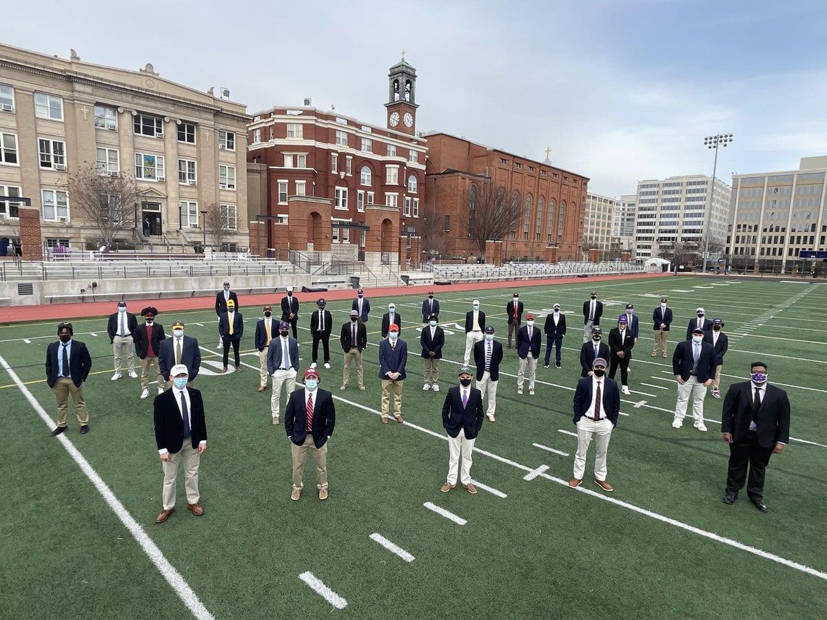 Gonzaga Seniors pose for signing day on the field; this is one of the many events that had a different format because of covid. (Photo from Gonzaga Twitter)