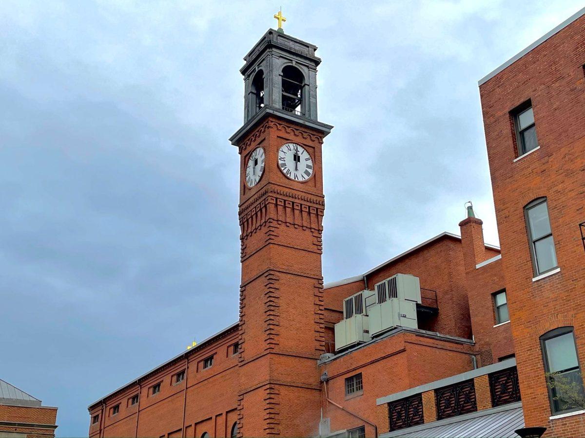 St. Al's clock tower is a very special part of the Gonzaga campus. This rare photo shows the usually hidden flap windows opened at the center of each clock face. (Photo by Will Thompson)