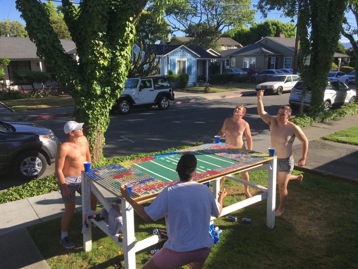 Fraternity members play Beer Die, a popular drinking game in college. https://commons.wikimedia.org/wiki/File:Beer_Die.jpg