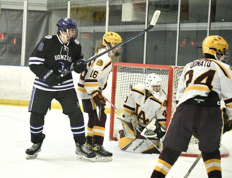 Senior Ryan Christiano spots a puck along the boards. Photo from Gonzaga Flickr