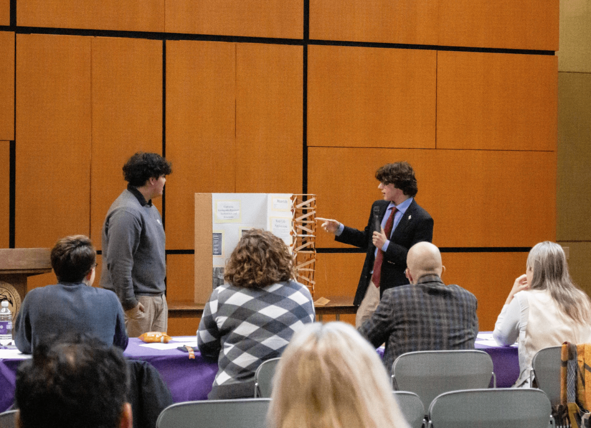 George Koutrouvelis, sophomore, presents with his student partner from WJA. Photo by Joey and Enzo Bunag /Photo II