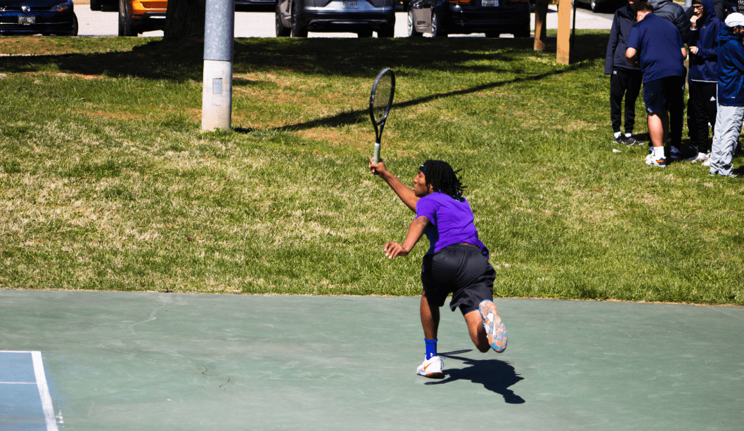 Preston Burton 24' plays singles. Photo by Lee White