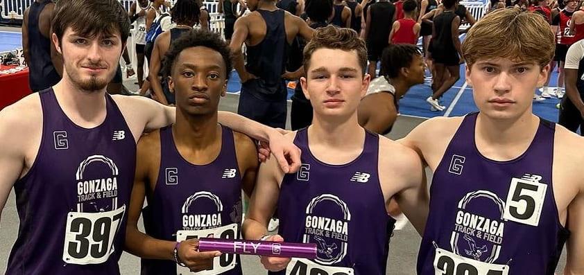 Jude McGroarty '24, Jackson Winder '24, John Dearie '24, Calvin Timm '25, holding a baton after running in the 4x400m dash. Photo from Gonzaga Track Instagram. 