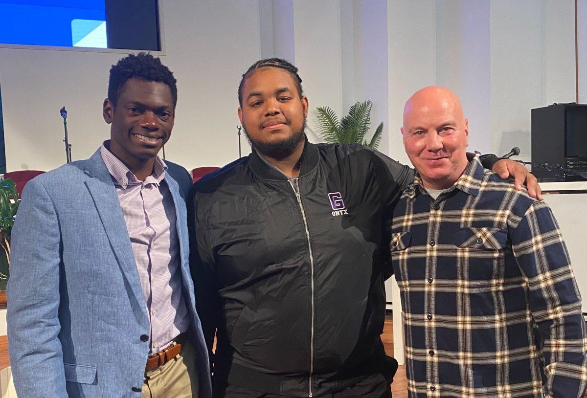 James White '24, Chris Settle '25, and Mr. Joseph Ross at the Parkmont Poetry Festival Reading (Photo courtesy of Settle)