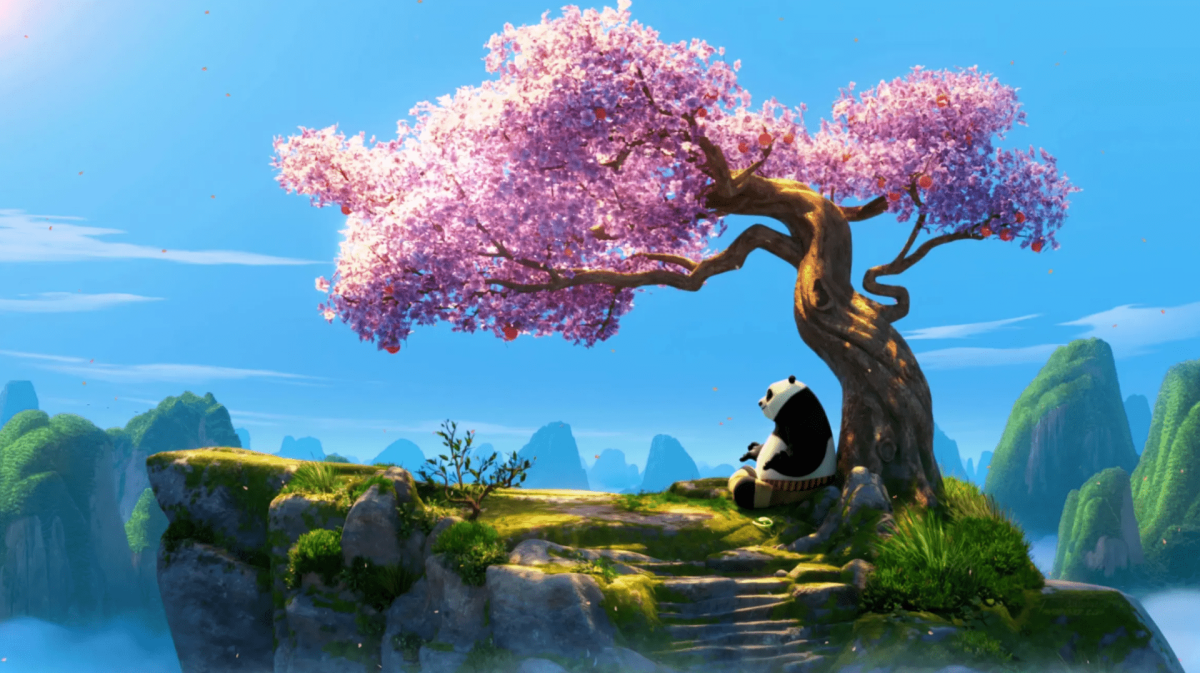 Po, the films protagonist, sitting by a cherry tree.